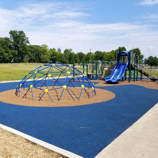 Park playground geodome on blue rubber